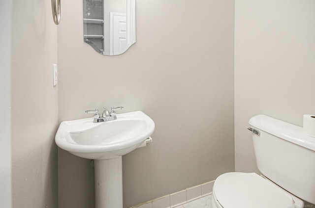 bathroom with tile patterned floors and toilet
