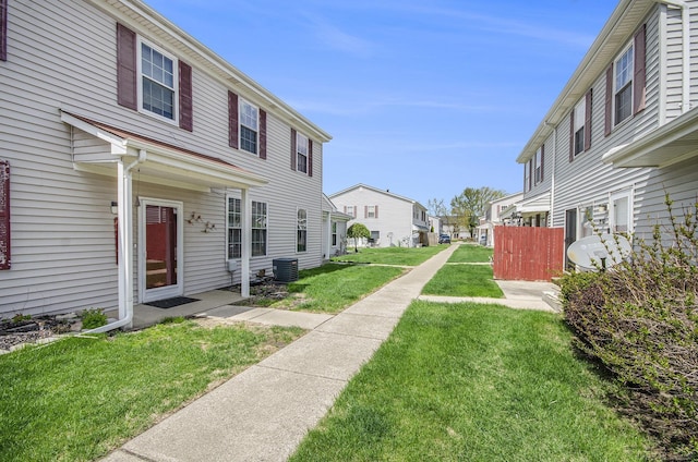 exterior space with a residential view and central AC unit