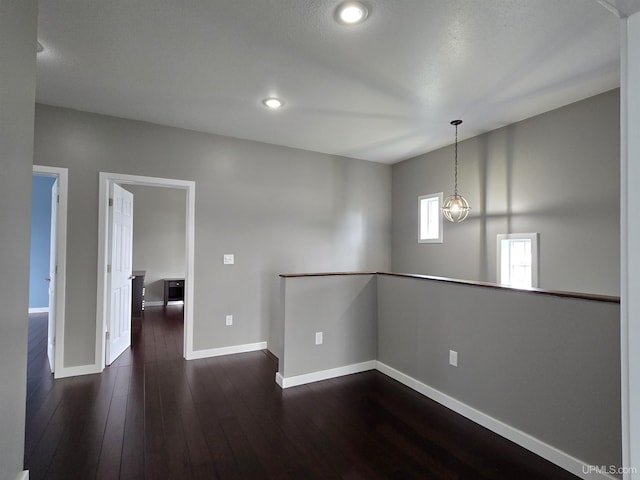 1812 Lake Shore Dr, Escanaba, MI 49829 - empty room with dark wood-style floors, baseboards, and recessed lighting