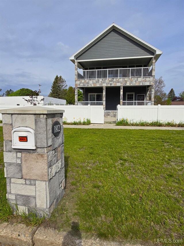 1812 Lake Shore Dr, Escanaba, MI 49829 - view of front of house with a balcony