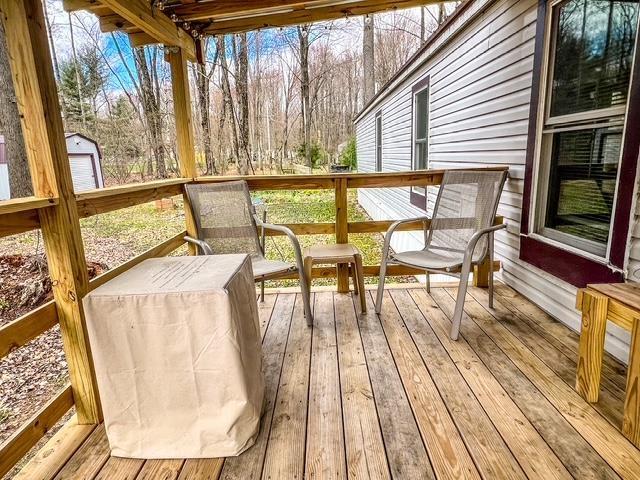 deck with an outbuilding