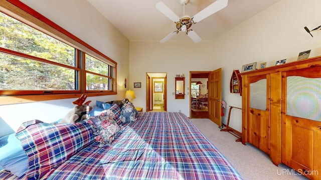 bedroom featuring a ceiling fan and light carpet