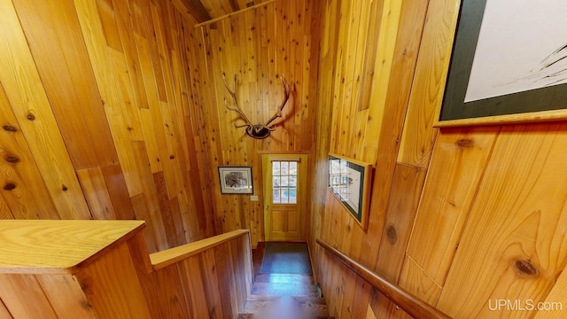 interior space featuring wood walls