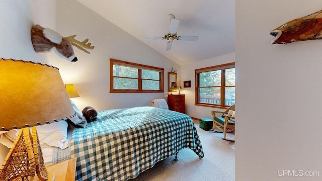carpeted bedroom with ceiling fan and lofted ceiling