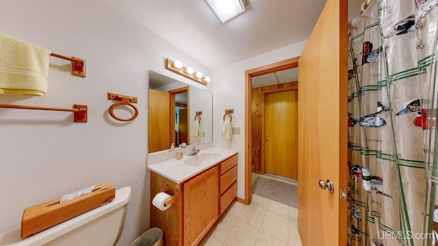 bathroom with lofted ceiling, toilet, a shower with shower curtain, tile patterned flooring, and vanity