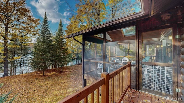 wooden deck featuring a sunroom