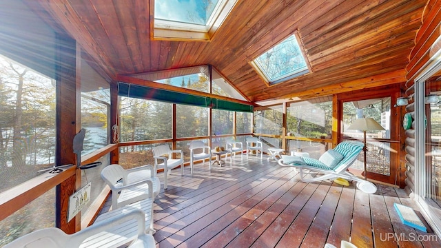 unfurnished sunroom with a skylight