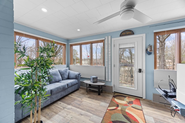 interior space featuring light wood-style floors and a ceiling fan