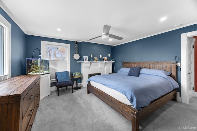 bedroom with a ceiling fan, ornamental molding, and light colored carpet
