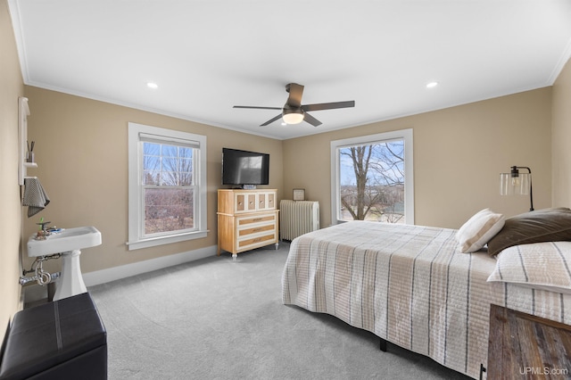 bedroom with carpet, a ceiling fan, radiator, crown molding, and baseboards
