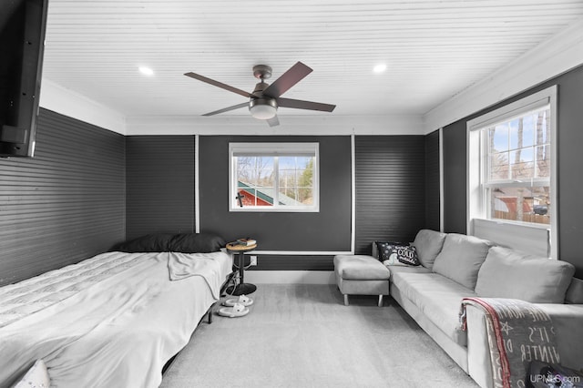 bedroom featuring baseboards, multiple windows, a ceiling fan, and carpet floors