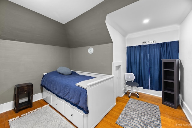 bedroom featuring wood finished floors