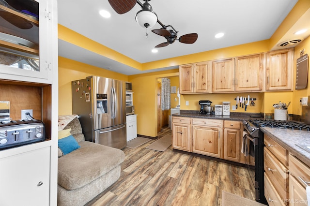 kitchen with a ceiling fan, light brown cabinets, recessed lighting, wood finished floors, and stainless steel appliances