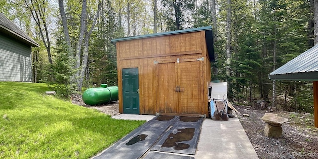 N9006 Sand River Rd, Deerton, MI 49822 - view of shed featuring a wooded view