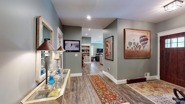 N9006 Sand River Rd, Deerton, MI 49822 - foyer entrance featuring visible vents, wood finished floors, baseboards, and recessed lighting