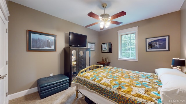 N9006 Sand River Rd, Deerton, MI 49822 - bedroom featuring carpet flooring, baseboards, and ceiling fan
