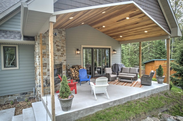 N9006 Sand River Rd, Deerton, MI 49822 - view of patio / terrace with an outdoor structure, a shed, and outdoor lounge area