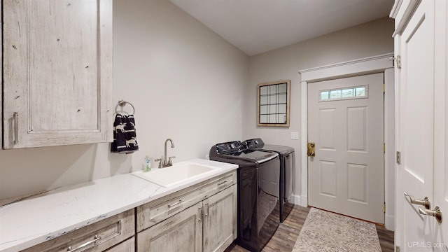 N9006 Sand River Rd, Deerton, MI 49822 - washroom featuring washing machine and clothes dryer, dark wood-style floors, cabinet space, and a sink