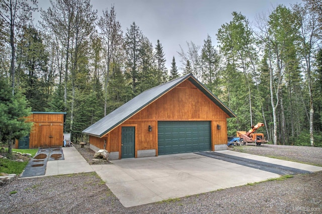 N9006 Sand River Rd, Deerton, MI 49822 - detached garage featuring a wooded view
