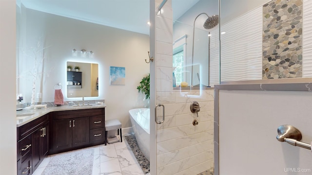 N9006 Sand River Rd, Deerton, MI 49822 - full bathroom with a sink, marble finish floor, double vanity, tiled shower, and a freestanding tub
