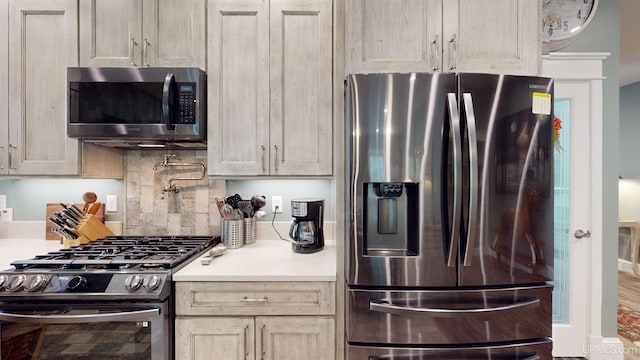 N9006 Sand River Rd, Deerton, MI 49822 - kitchen with light countertops, stainless steel appliances, and tasteful backsplash