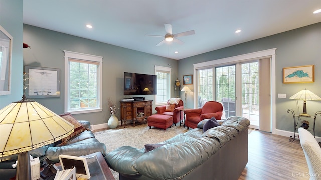 N9006 Sand River Rd, Deerton, MI 49822 - living room with baseboards, a healthy amount of sunlight, and ceiling fan