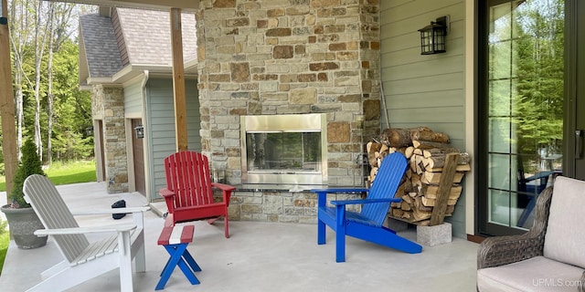 N9006 Sand River Rd, Deerton, MI 49822 - view of patio / terrace with an outdoor stone fireplace