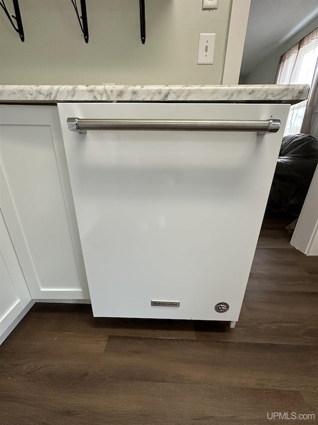 room details with wood finished floors and white dishwasher