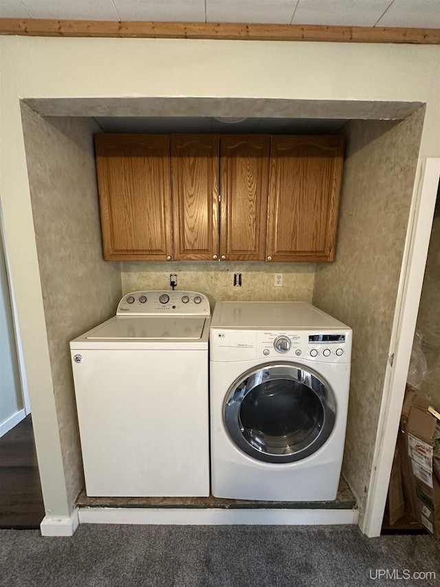 laundry room featuring washer and dryer and cabinet space