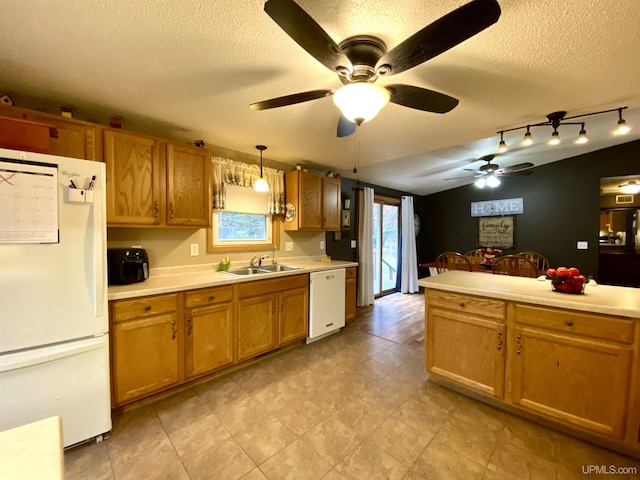 kitchen with ceiling fan, a textured ceiling, and white appliances