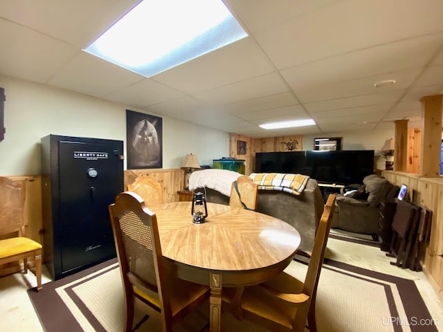 dining area featuring a drop ceiling