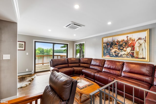 living area with ornamental molding, a baseboard radiator, and hardwood / wood-style floors