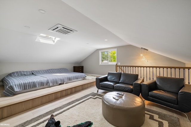 bedroom with lofted ceiling and visible vents