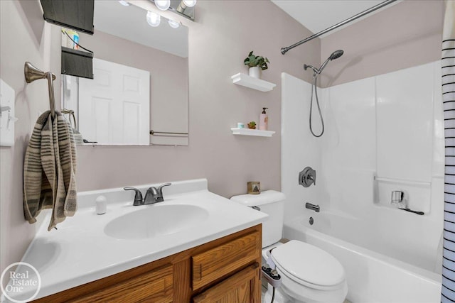 bathroom with toilet, shower / bath combination, and vanity