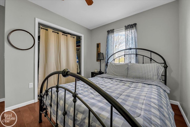 bedroom featuring wood finished floors, baseboards, and ceiling fan