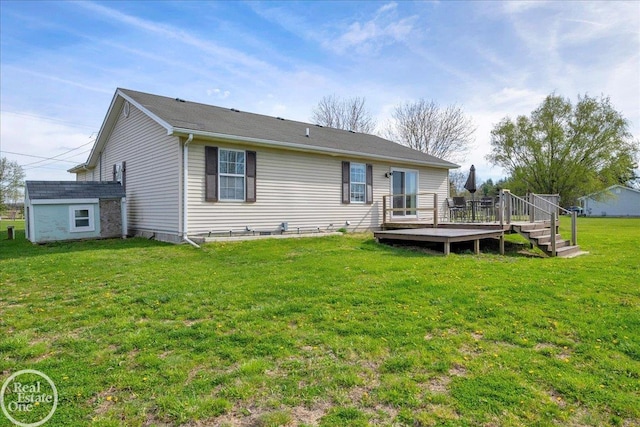 back of house with a yard and a wooden deck