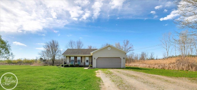 view of front of house with a front yard, a porch, dirt driveway, and a garage
