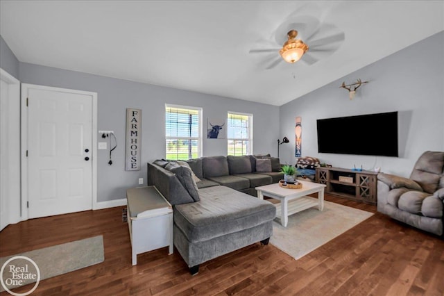 living area featuring vaulted ceiling, dark wood-style flooring, and a ceiling fan