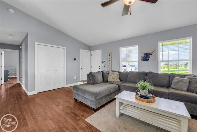 living room with baseboards, wood finished floors, lofted ceiling, and ceiling fan