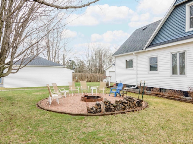 view of yard with a fire pit