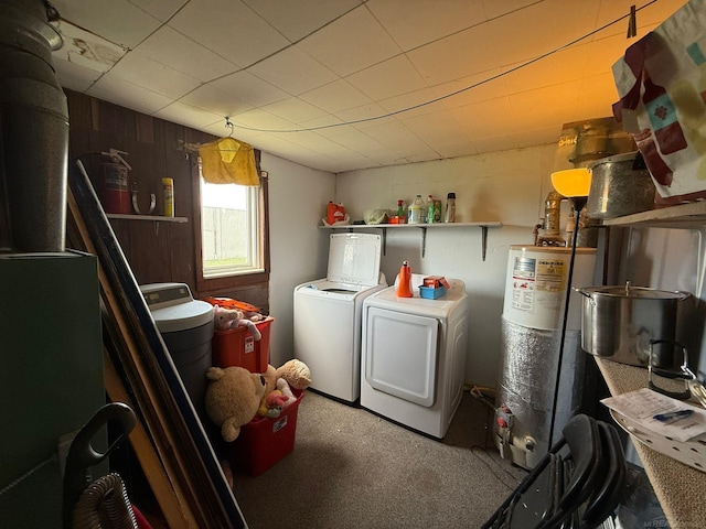 laundry room with water heater, carpet, and washer and clothes dryer
