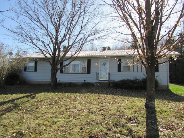 25485 Opal Rd, Watton, MI 49970 - single story home with a chimney, a front lawn, and a metal roof