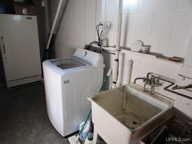 25485 Opal Rd, Watton, MI 49970 - laundry room with washer / dryer and concrete block wall