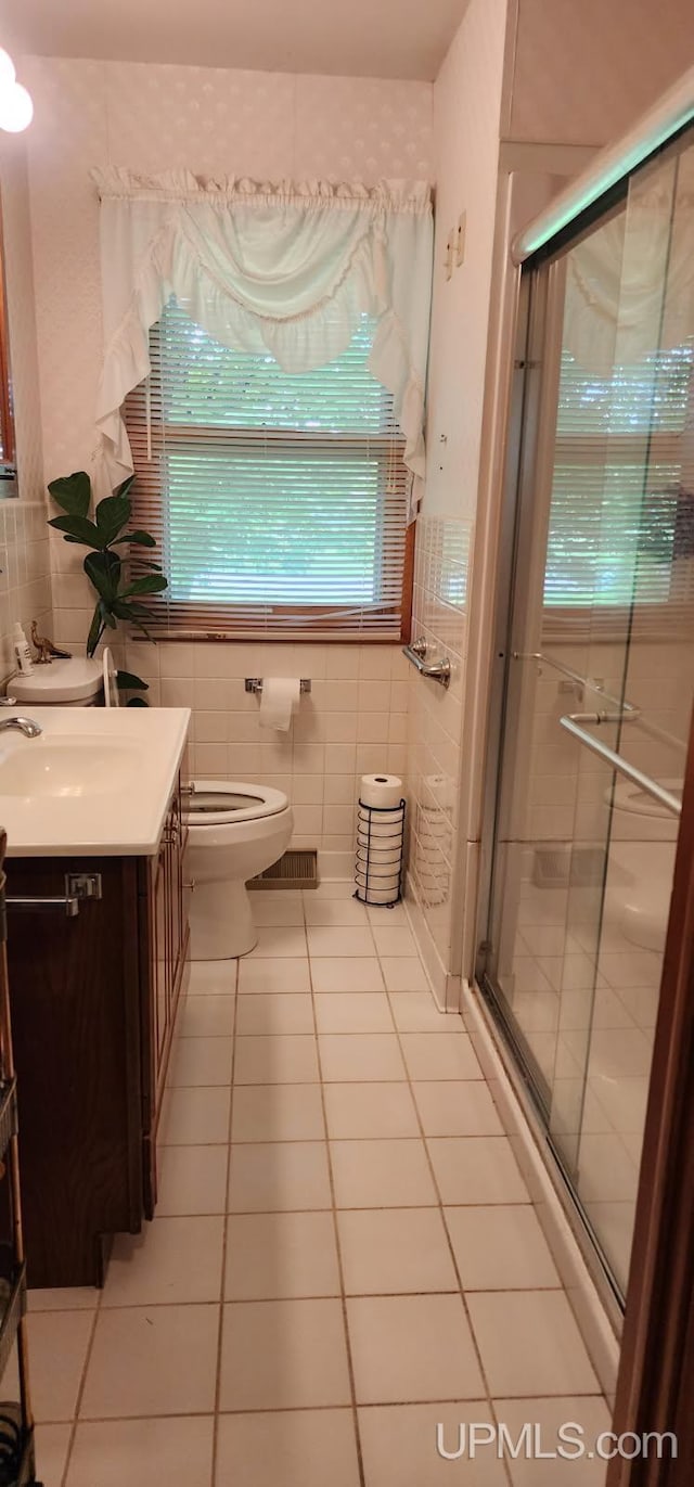 25485 Opal Rd, Watton, MI 49970 - full bath with tile walls, tile patterned floors, vanity, and a shower stall