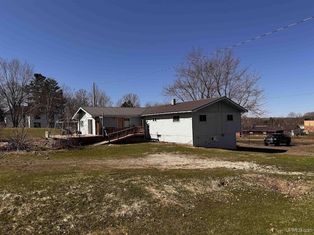 view of front of home with metal roof and a deck
