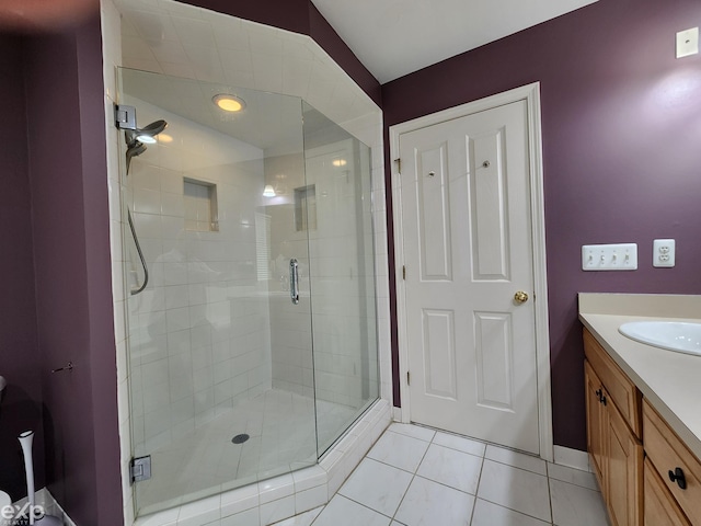 bathroom featuring a shower stall, tile patterned flooring, and vanity