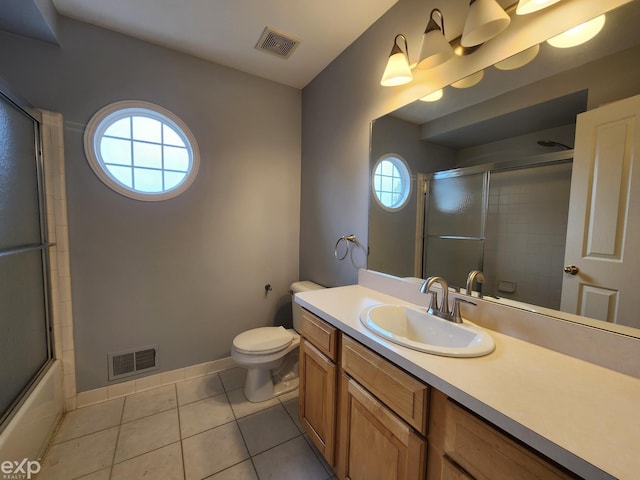 bathroom with toilet, tile patterned floors, vanity, and visible vents