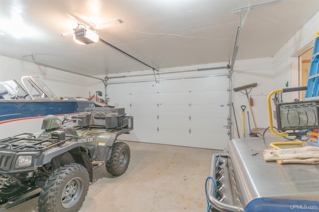 garage with washer / dryer and a garage door opener
