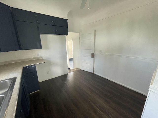 301 Michigan Ave, Bay City, MI 48708 - kitchen with a ceiling fan, light countertops, dark wood finished floors, and a sink