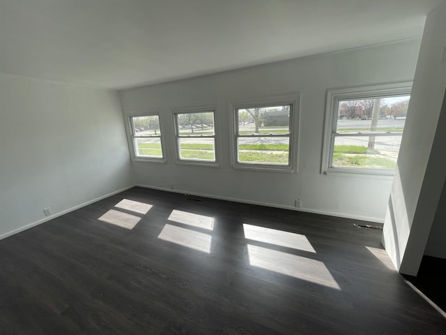 301 Michigan Ave, Bay City, MI 48708 - empty room with dark wood finished floors and baseboards